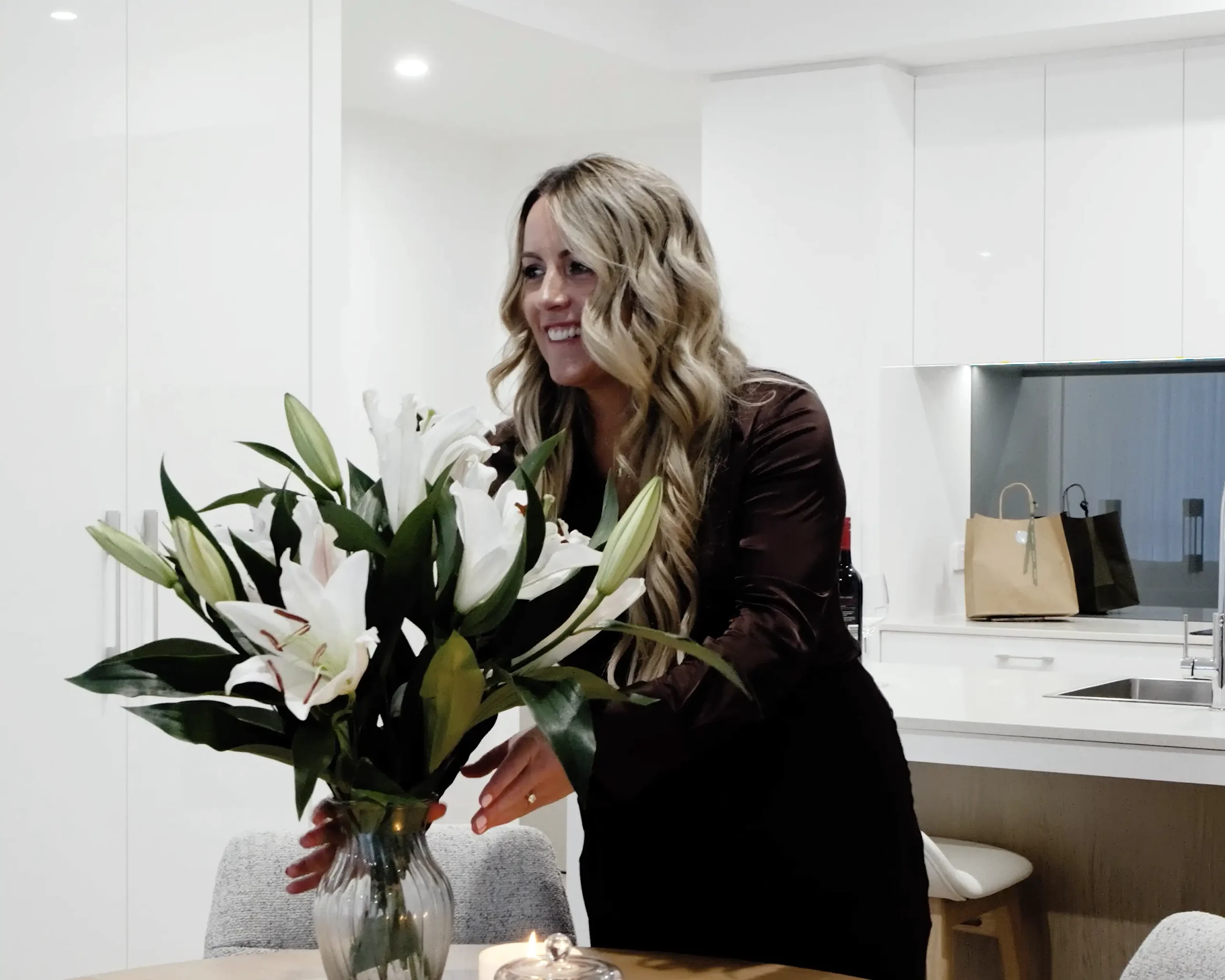 lady arranging flowers in a vase